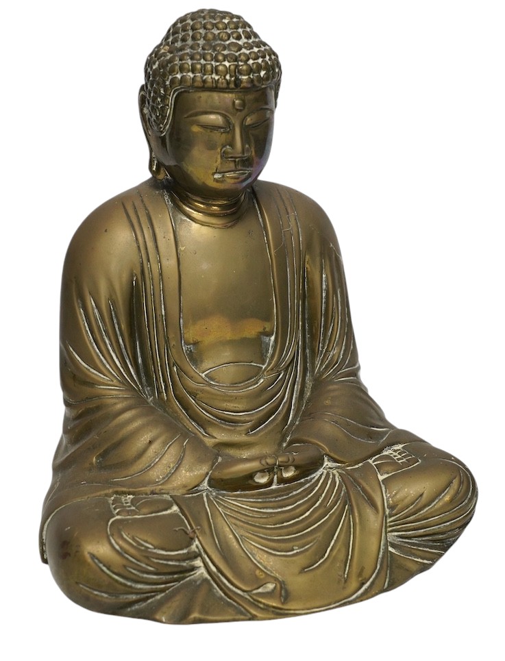 A cast brass figure of Buddha, 27cm high. Condition - fair to good